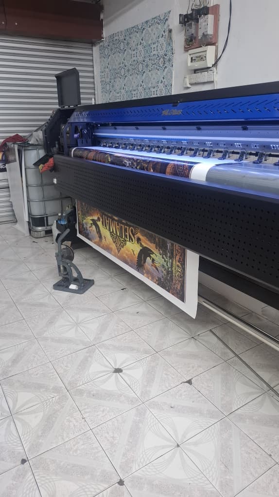 Banner printing in progress at production shop